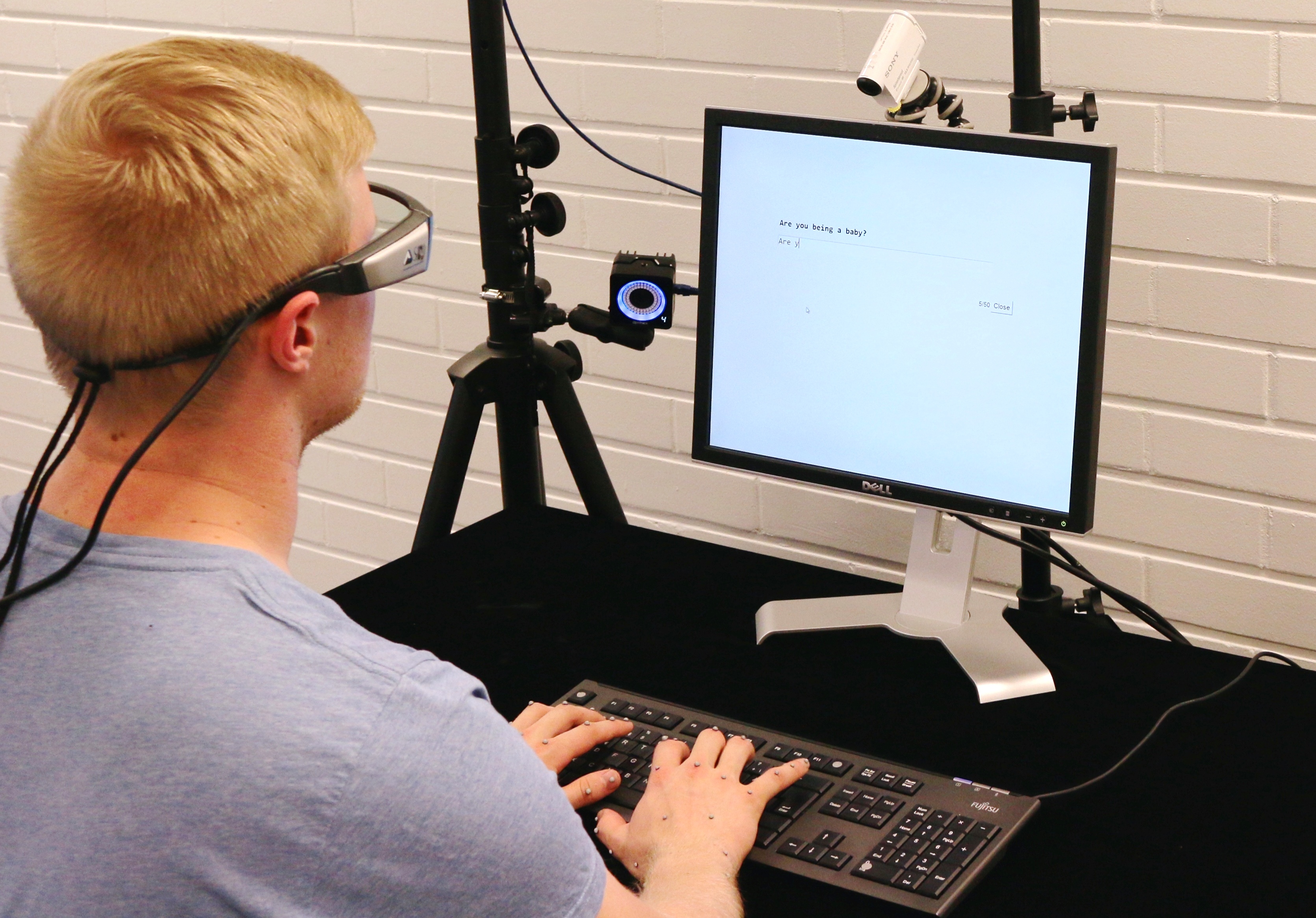 Typist with eye tracking glasses